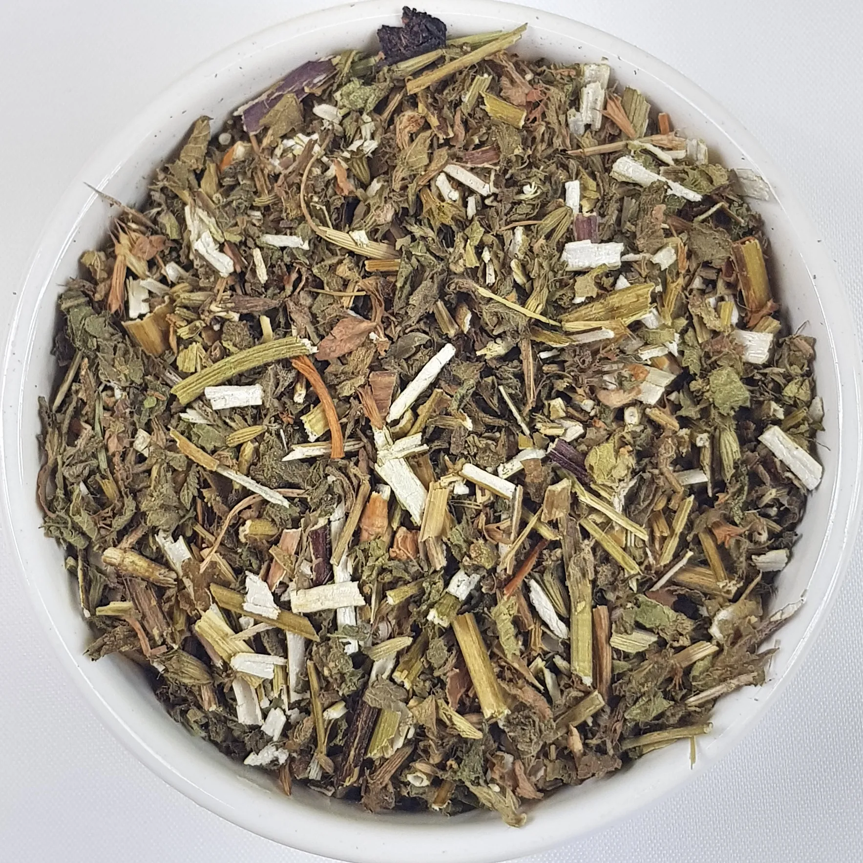 Black Horehound Herb Herba Organica in a ceramic bowl showing dried leaves and stems with earthy texture.