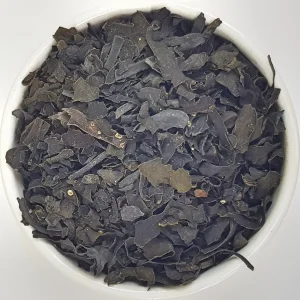 Bladderwrack Herba Organica in a ceramic bowl showing dried Fucus vesiculosus L. with natural seaweed texture